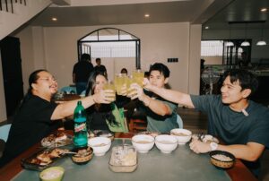 River Joseph, Ninong Ry, Dustin Yu, and Nisa Nuggets enjoy a toast