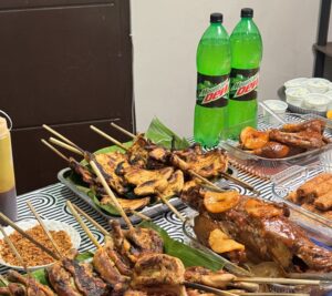 A spread of grilled inasal, home-cooked dishes, and Mountain Dew comes together for another authentic Bacolod fiesta feast 